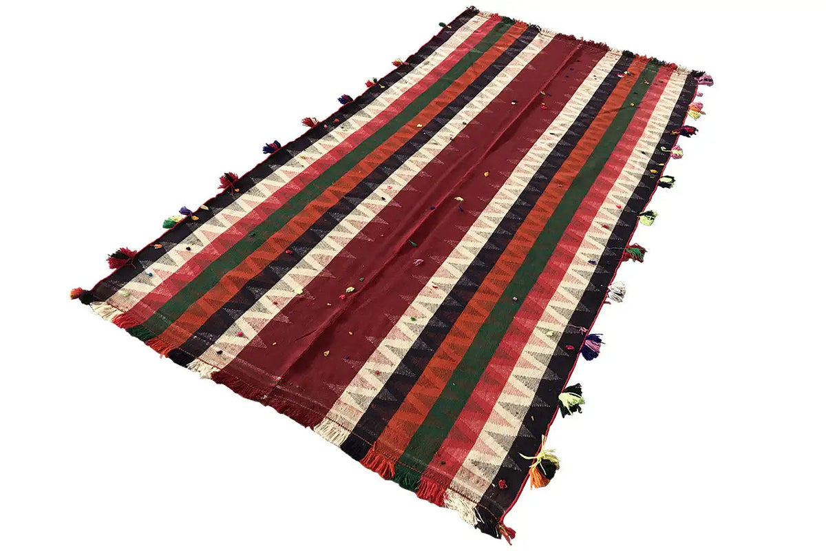 Jajim rug with stripes in red, green, blue, and cream, plus colorful tassels