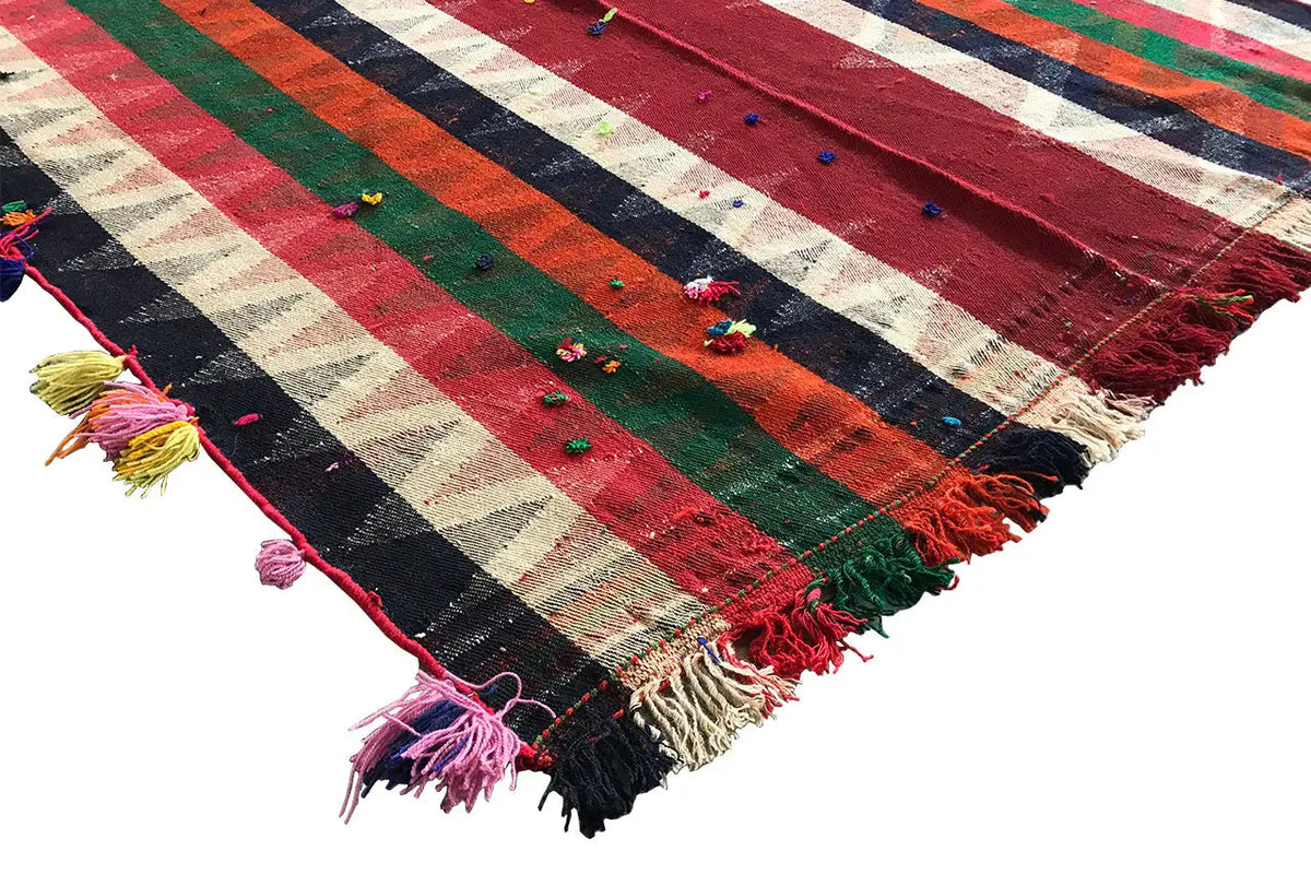 Jajim rug corner with fringes and tassels, striped color gradient in red, green, blue