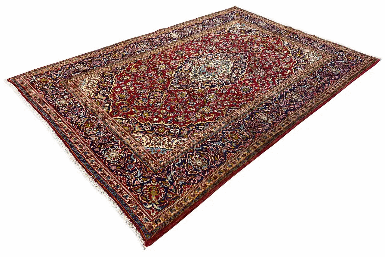 Red and colorful Oriental rug with a delicate medallion pattern and decorative border, rectangular