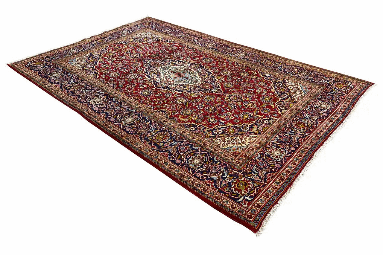 Red multicolored Oriental rug with a large medallion and decorative border
