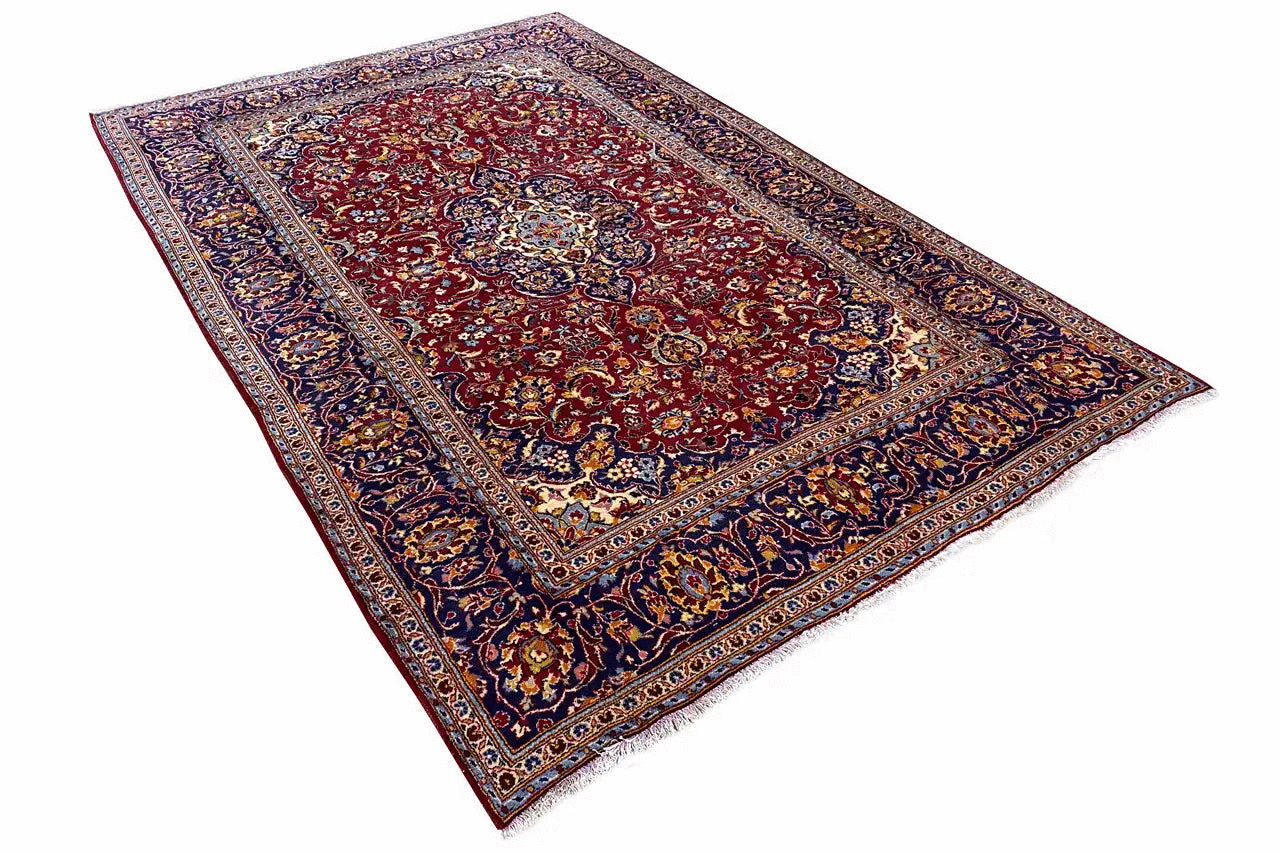 Keshan red oriental rug with central medallion and colorful border