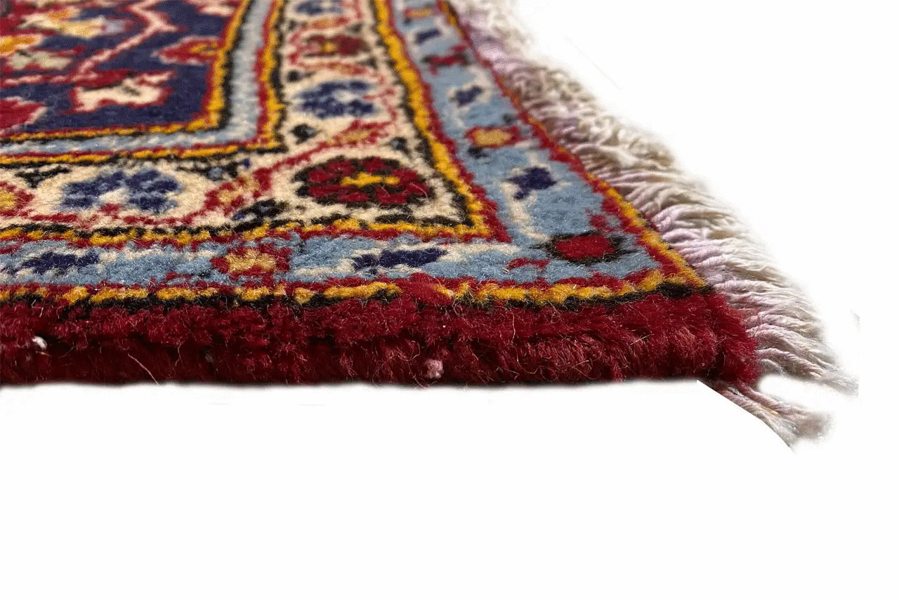 Border detail with fringe on the oriental rug and colorful pattern