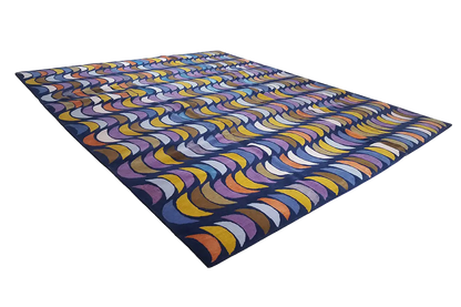 Rug with an abstract wave pattern, diagonal view, blue, yellow, and violet