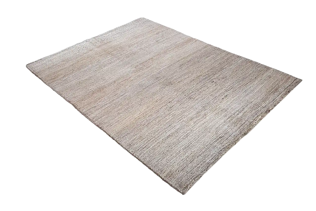 Gabbeh natural rug, beige mélange tone with a fine linear texture, photographed at an angle