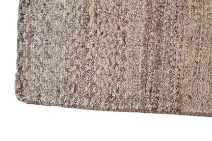 Gabbeh natural rug: dense pile in a beige natural tone, close-up of the rug surface
