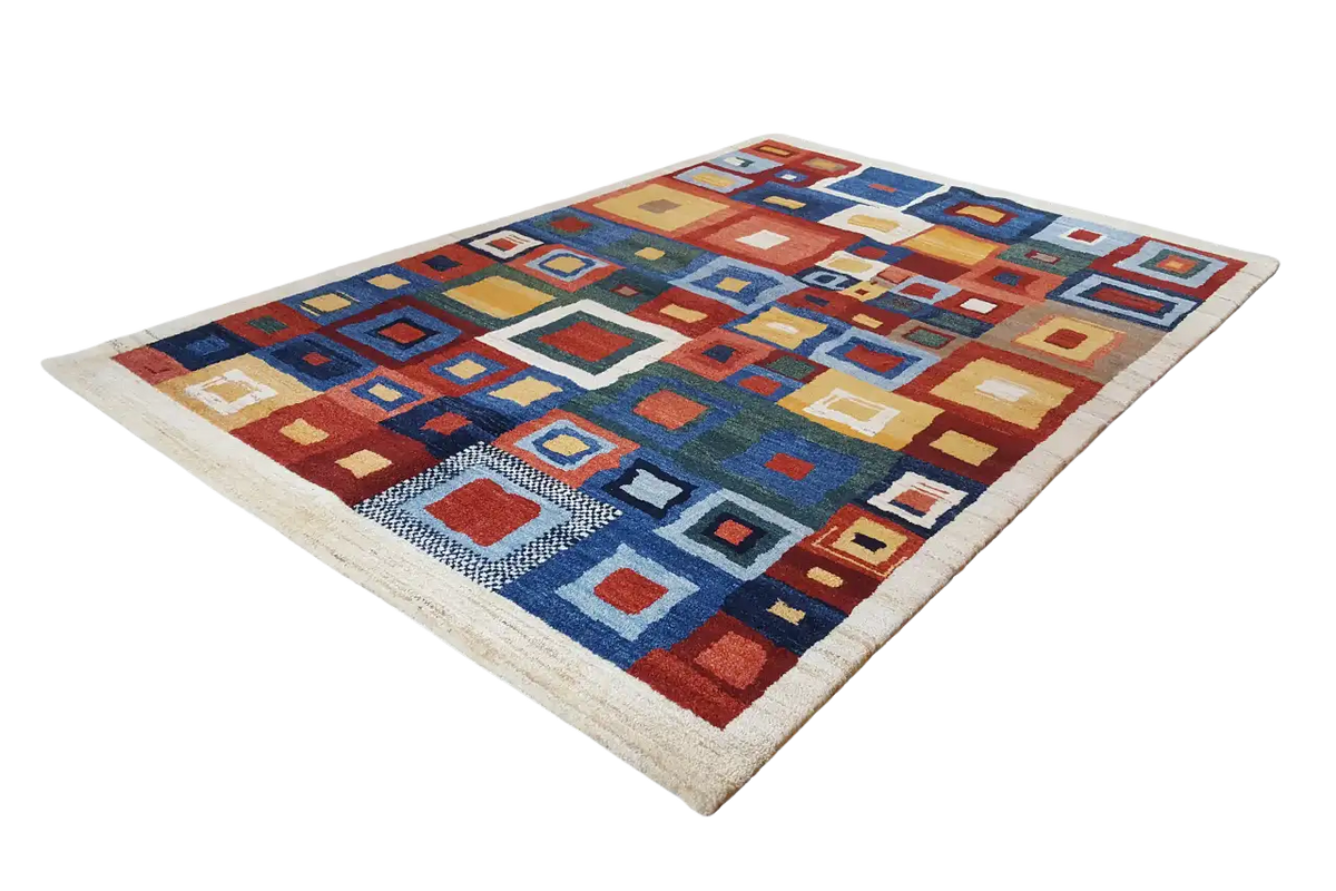 Rectangular rug with a square color pattern in blue, red, orange, and beige