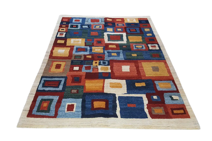 Rectangular rug with colorful squares in blue, red, yellow, and cream