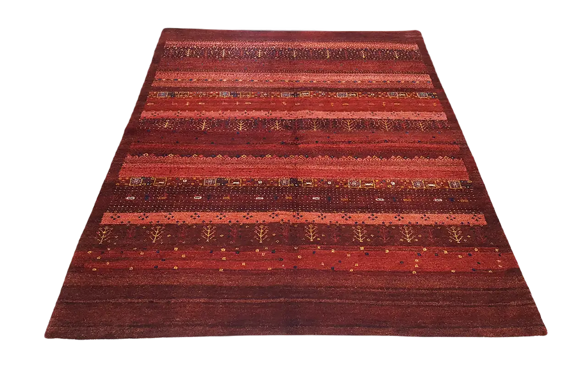 Gabbeh rug with a wide central stripe and horizontal bands in shades of red.