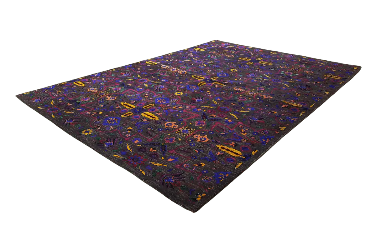 Silk sari spread flat, geometric color pattern in purple, blue, and yellow