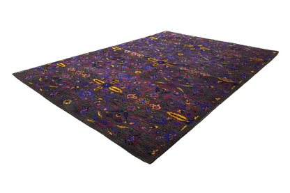 Silk sari spread flat, geometric color pattern in purple, blue, and yellow