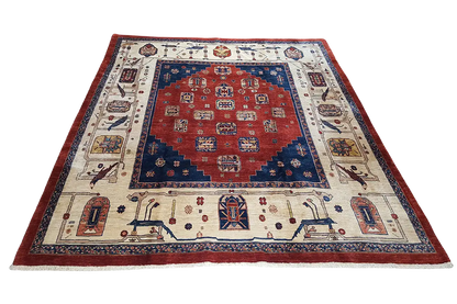 Qashqai classic rug with a red central field, blue medallion, and decorative border