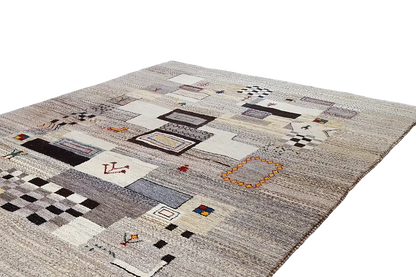 Gabbeh rug with square and line patterns in black, blue, and red on a light background