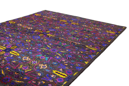 Silk sari with square-ended edges and a colorful pattern on a black background