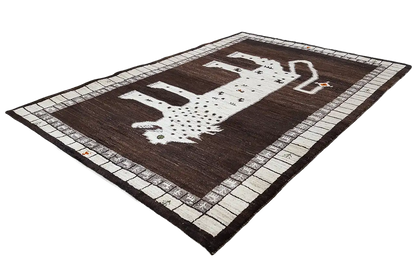 Gabbeh rug with a lion figure made of dots, brown with a beige border pattern